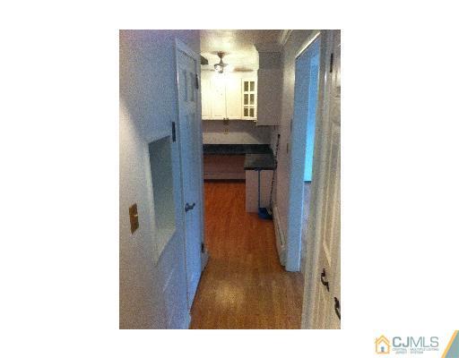 59 Middle Hill Road Colonia, NJ 07067 - Photo 8 of 25 a view of a bathroom from a hallway