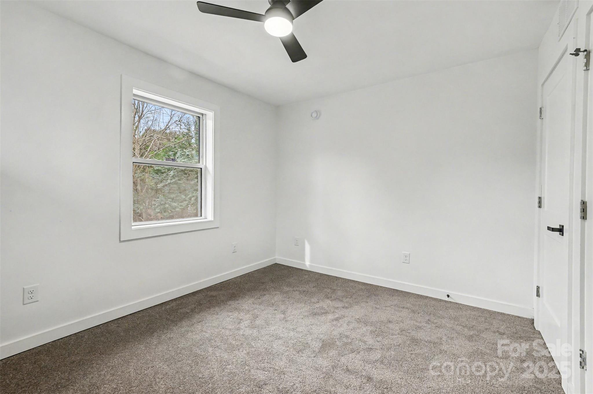 3417 Sudbury Road Charlotte, NC 28205 - Photo 11 of 18 an empty room with windows