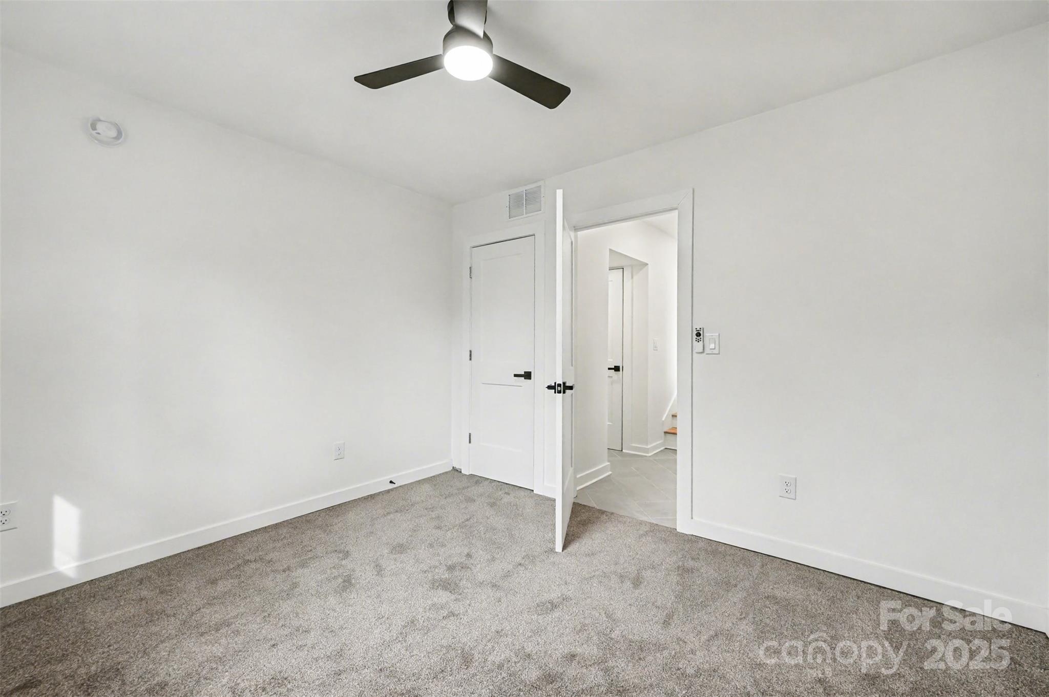 3417 Sudbury Road Charlotte, NC 28205 - Photo 12 of 18 an empty room with an entryway