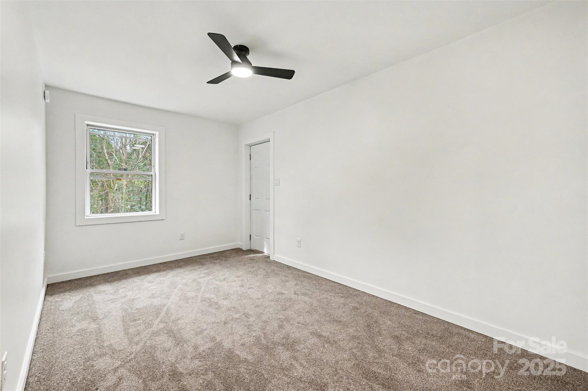 3417 Sudbury Road Charlotte, NC 28205 - Photo 13 of 18 an empty room with a window