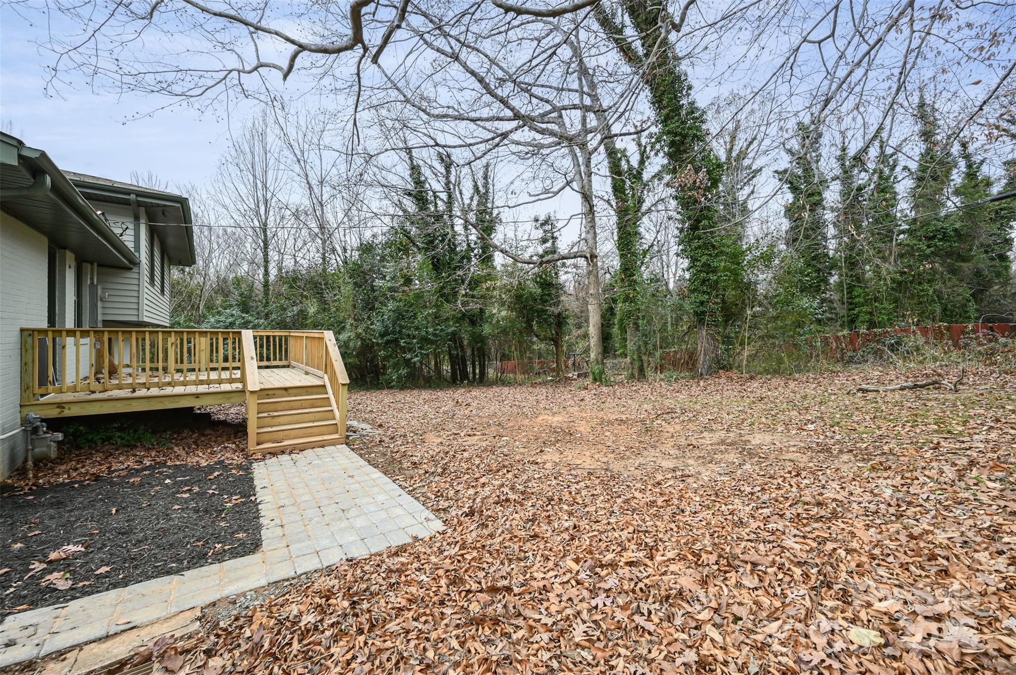 3417 Sudbury Road Charlotte, NC 28205 - Photo 15 of 18 a view of a yard with wooden fence