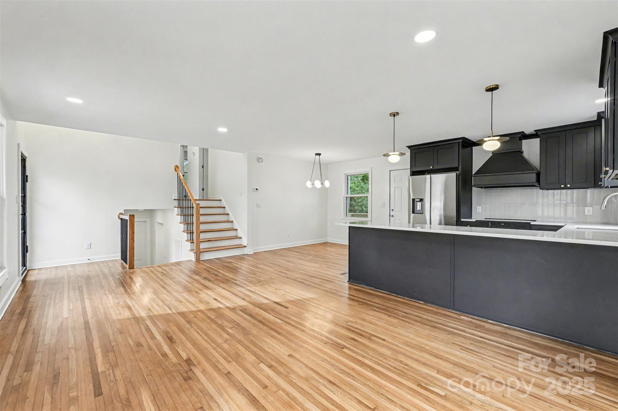 3417 Sudbury Road Charlotte, NC 28205 - Photo 4 of 18 a view of kitchen with wooden floor and electronic appliances