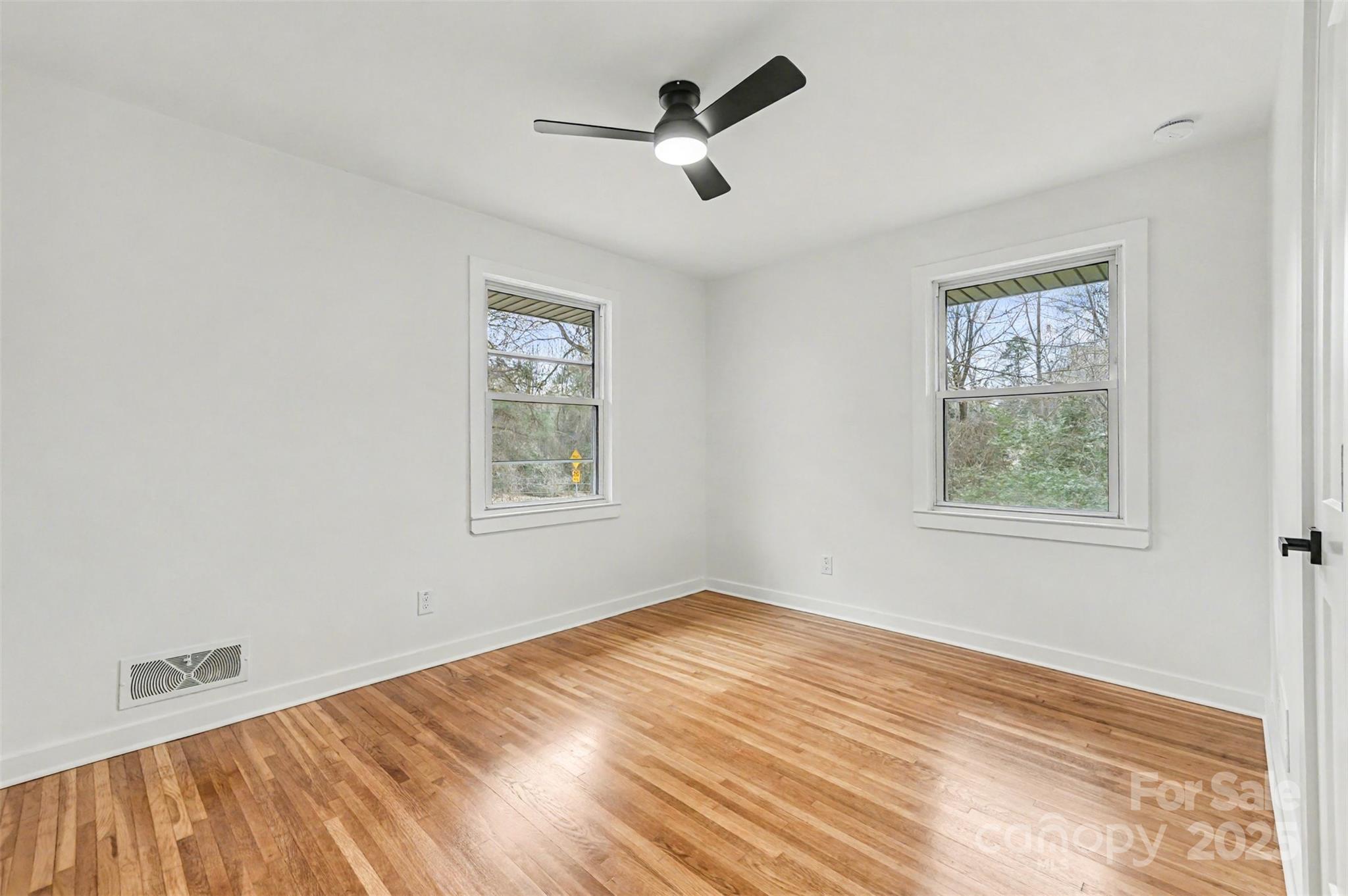 3417 Sudbury Road Charlotte, NC 28205 - Photo 7 of 18 a view of empty room with ceiling fan