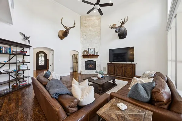 a living room with furniture and a fireplace