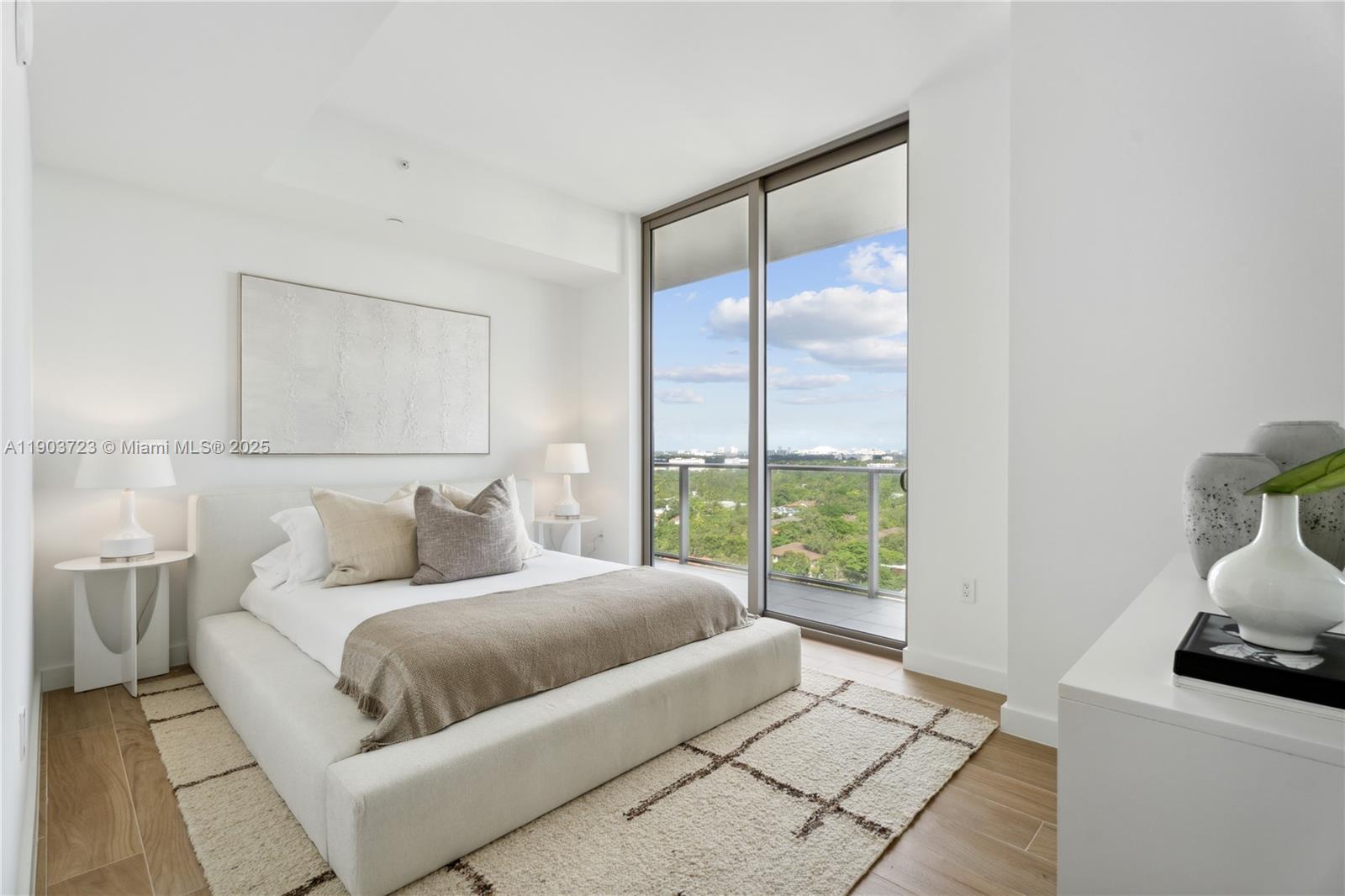 2678 Tigertail Avenue, Unit 1202 Miami, FL 33133 - Photo 13 of 20 a bedroom with a large bed and a window