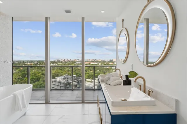 a living room with a large window and a table