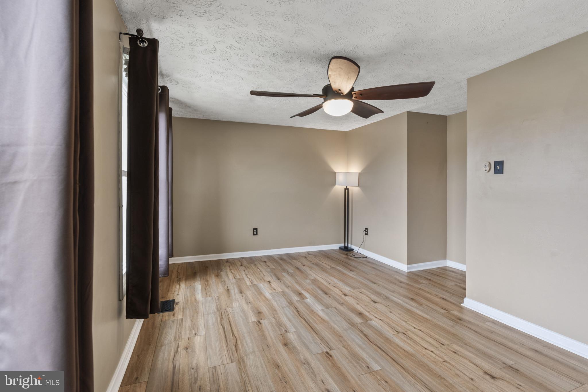 3210 Split Oak Court Abingdon, MD 21009 - Photo 11 of 17 a view of room with wooden floor ceiling fan and window