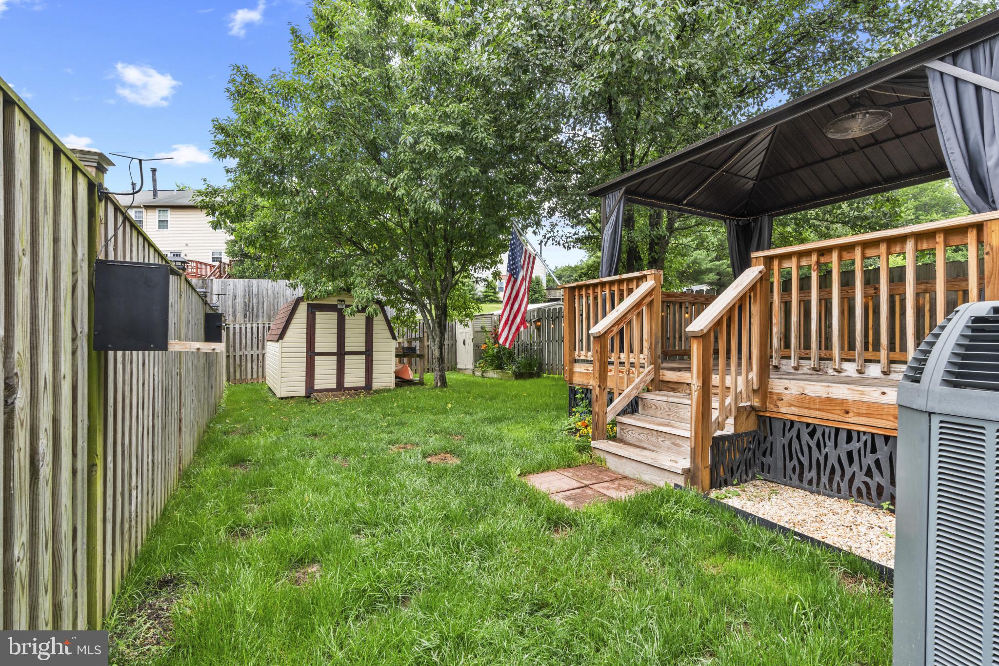 3210 Split Oak Court Abingdon, MD 21009 - Photo 16 of 17 a view of backyard with a deck and a garden