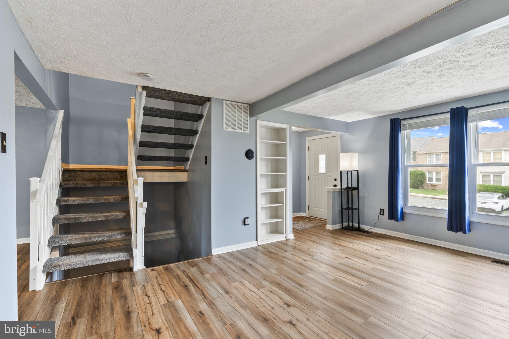 3210 Split Oak Court Abingdon, MD 21009 - Photo 4 of 17 a view of empty room with wooden floor and fan
