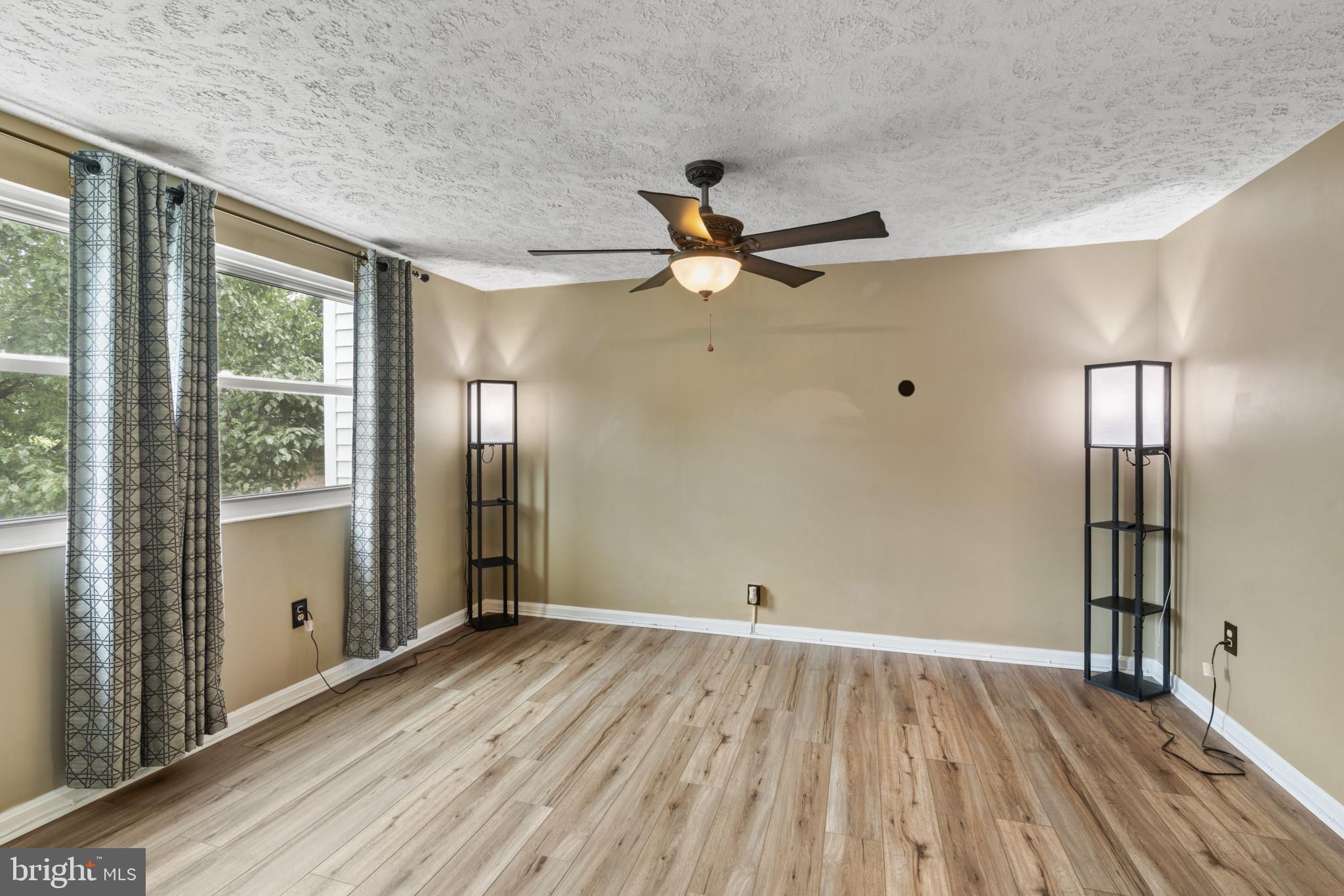 3210 Split Oak Court Abingdon, MD 21009 - Photo 10 of 17 wooden floor in an empty room with a window