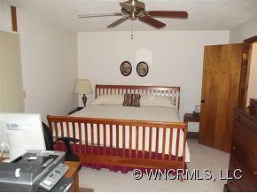 37 George Circle Maggie Valley, NC 28751 - Photo 13 of 15 a bed sitting in a bedroom next to a window