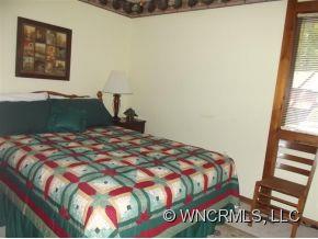 37 George Circle Maggie Valley, NC 28751 - Photo 15 of 15 a bedroom with a bed and a window