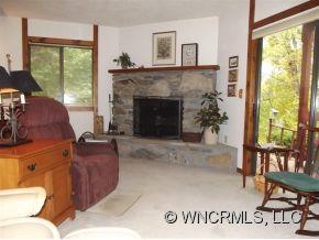37 George Circle Maggie Valley, NC 28751 - Photo 9 of 15 a living room with furniture and a fireplace