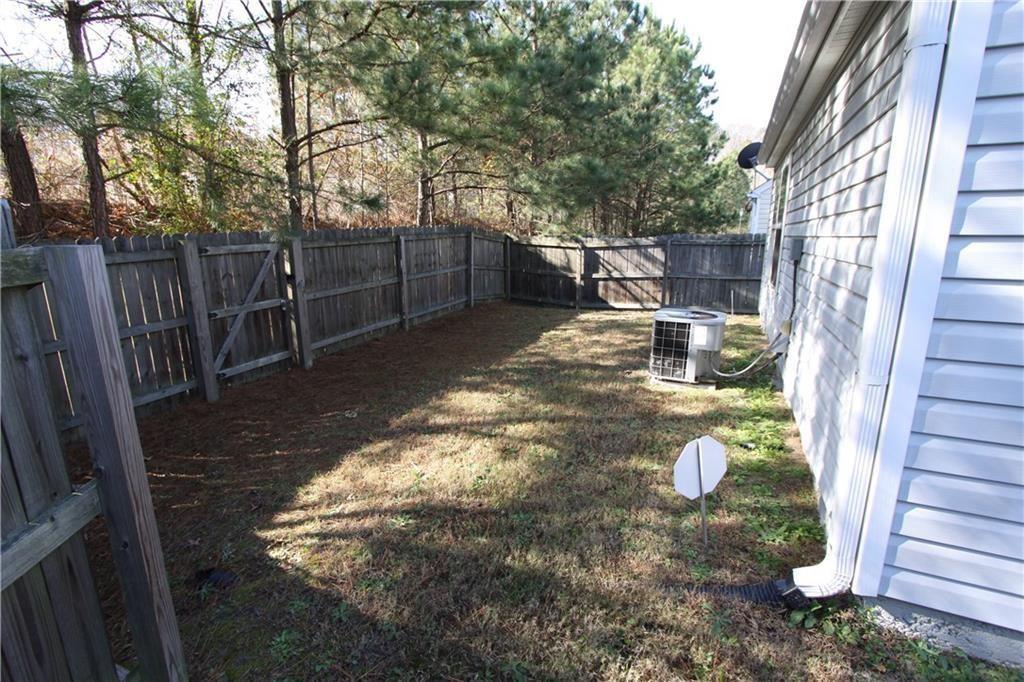 3480 Carriage Chase Road Atlanta, GA 30349 - Photo 3 of 7 a view of a back yard of the house