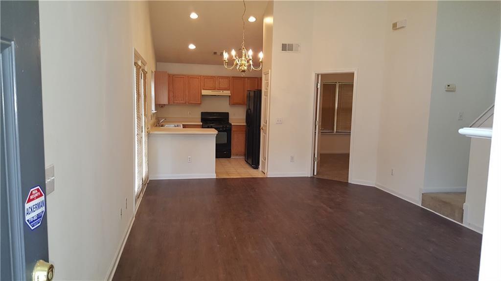 3480 Carriage Chase Road Atlanta, GA 30349 - Photo 4 of 7 a view of a kitchen with a sink and a refrigerator