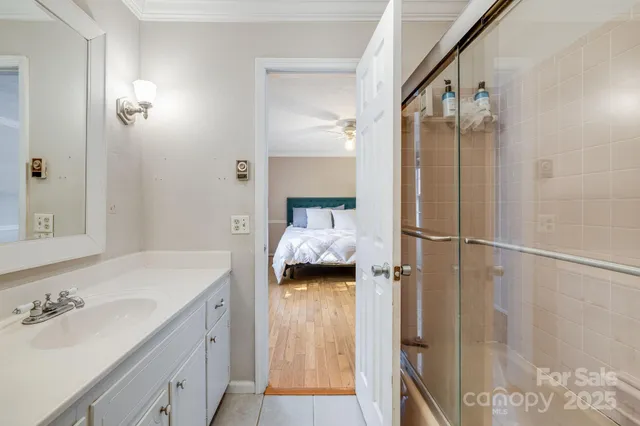 a bathroom with a sink and shower