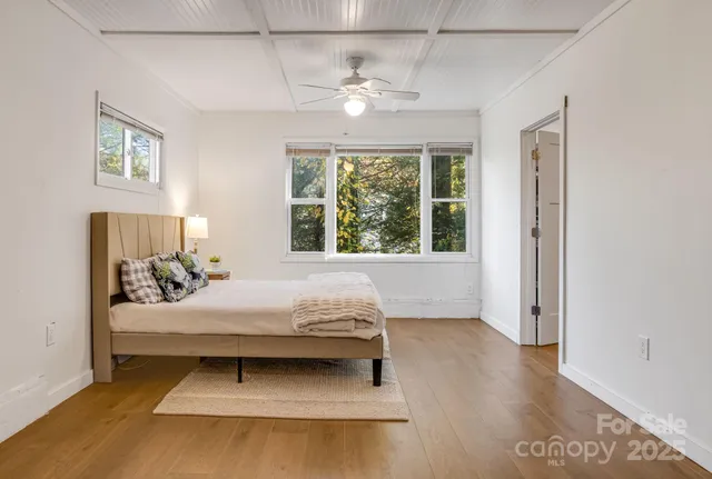 a bedroom with a bed and window
