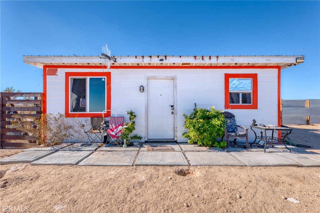 800 Brant Cross Road Twentynine Palms, CA 92277 - Photo 1 of 52 a view of a house with potted plants