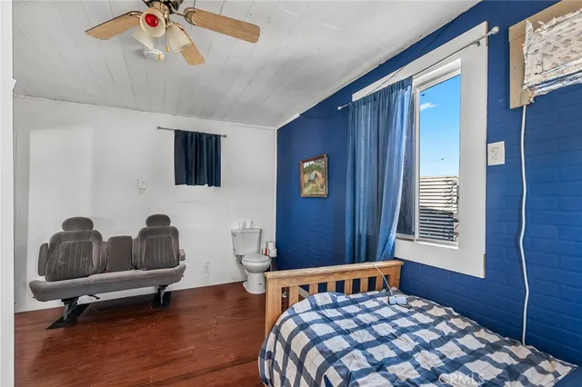 a bedroom with furniture and windows