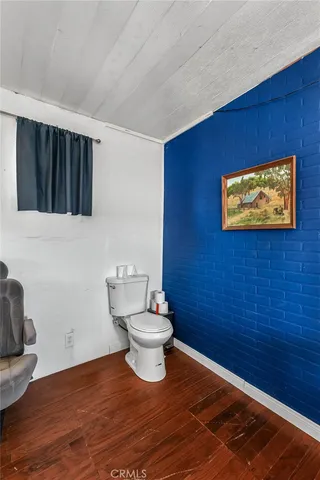 a bathroom with a toilet and a sink