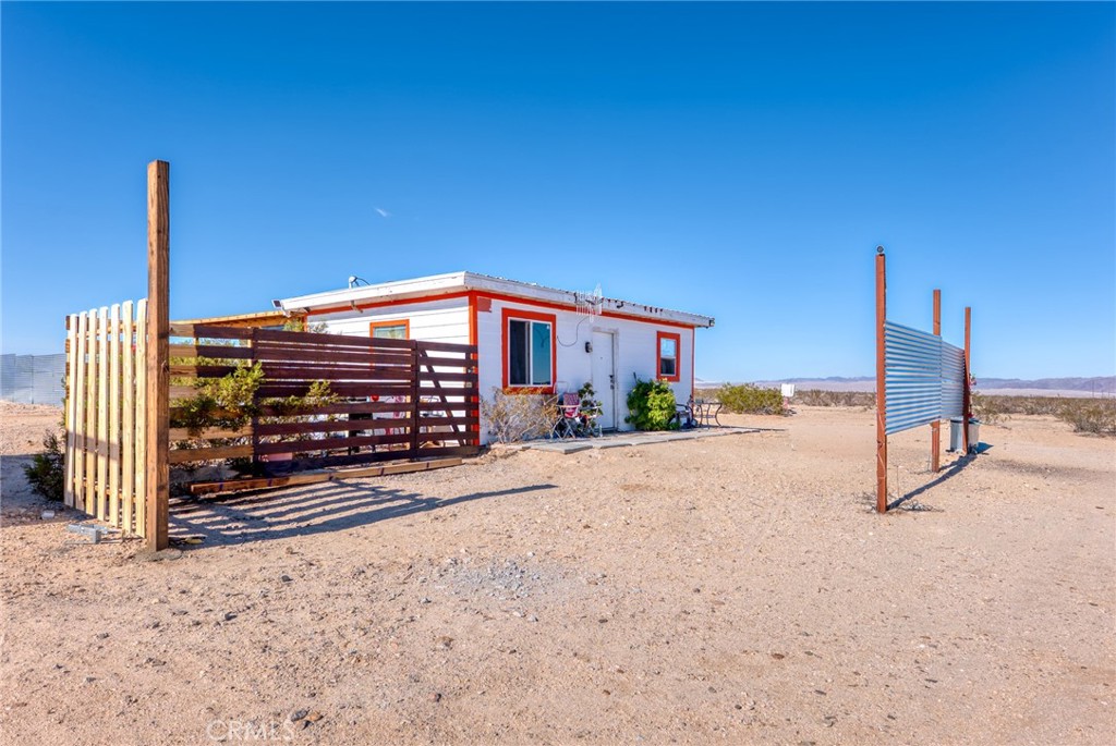 800 Brant Cross Road Twentynine Palms, CA 92277 - Photo 14 of 52 a view of a street with a building