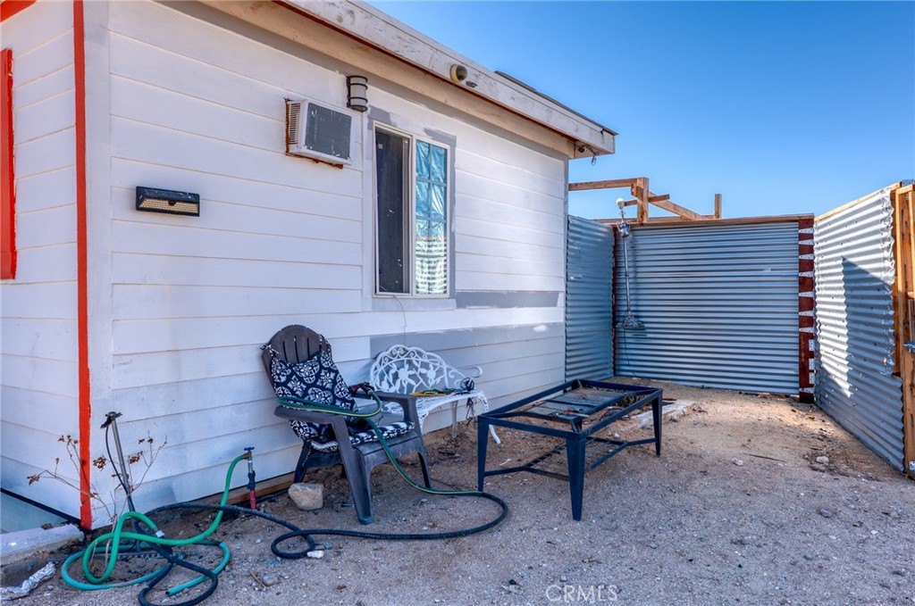 800 Brant Cross Road Twentynine Palms, CA 92277 - Photo 15 of 52 a view of a house with backyard and sitting area