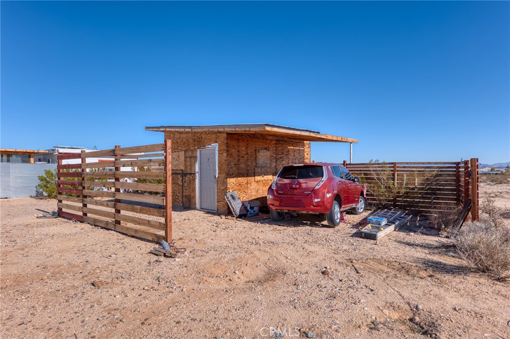 800 Brant Cross Road Twentynine Palms, CA 92277 - Photo 18 of 52 a view of a car park in front of house