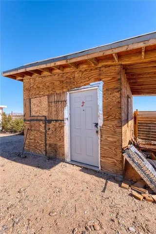 a view of a backyard of the house