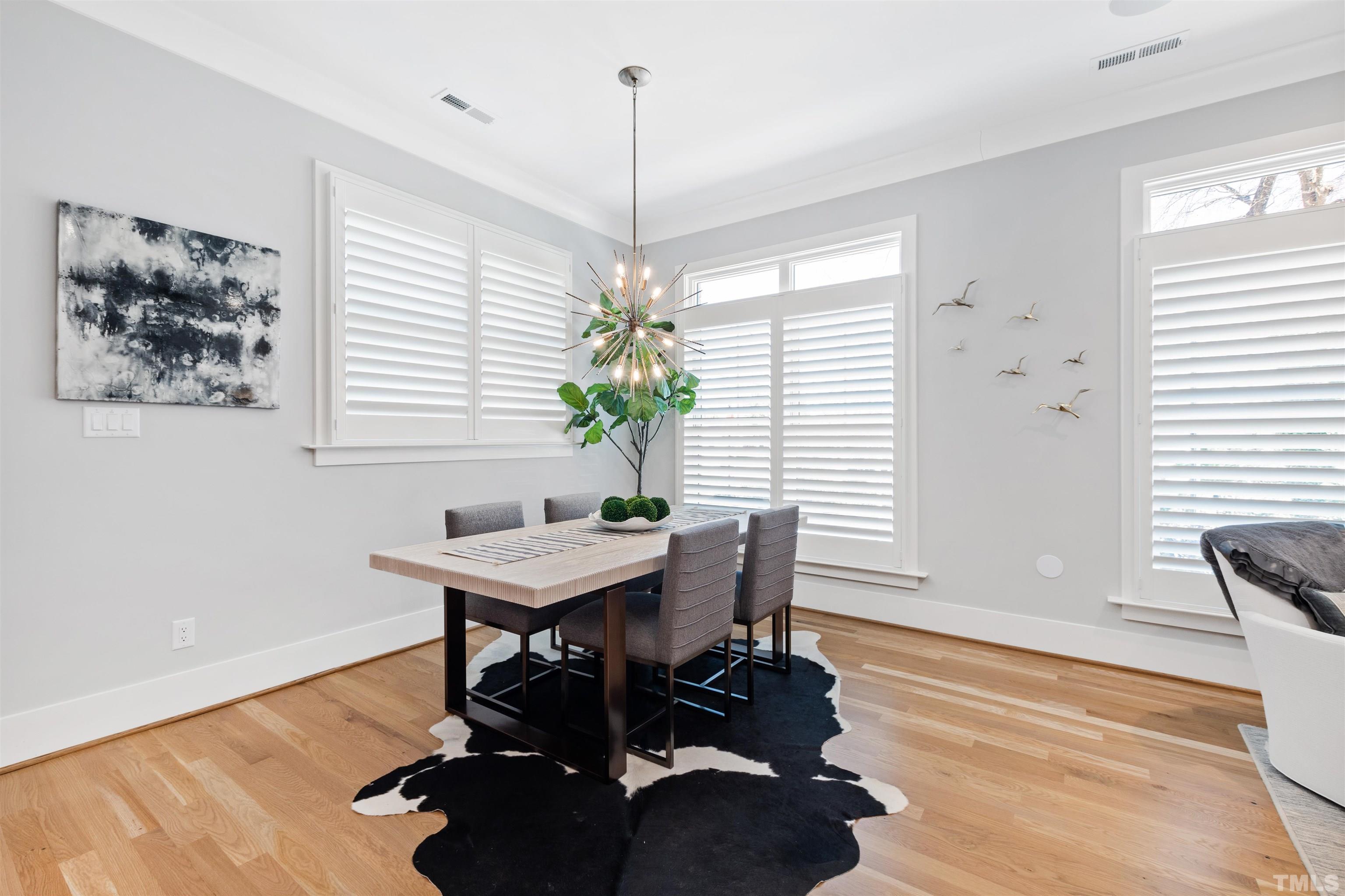 910 Oberlin Road, Unit 103 Raleigh, NC 27605 - Photo 17 of 47 a view of a workspace with furniture and a window