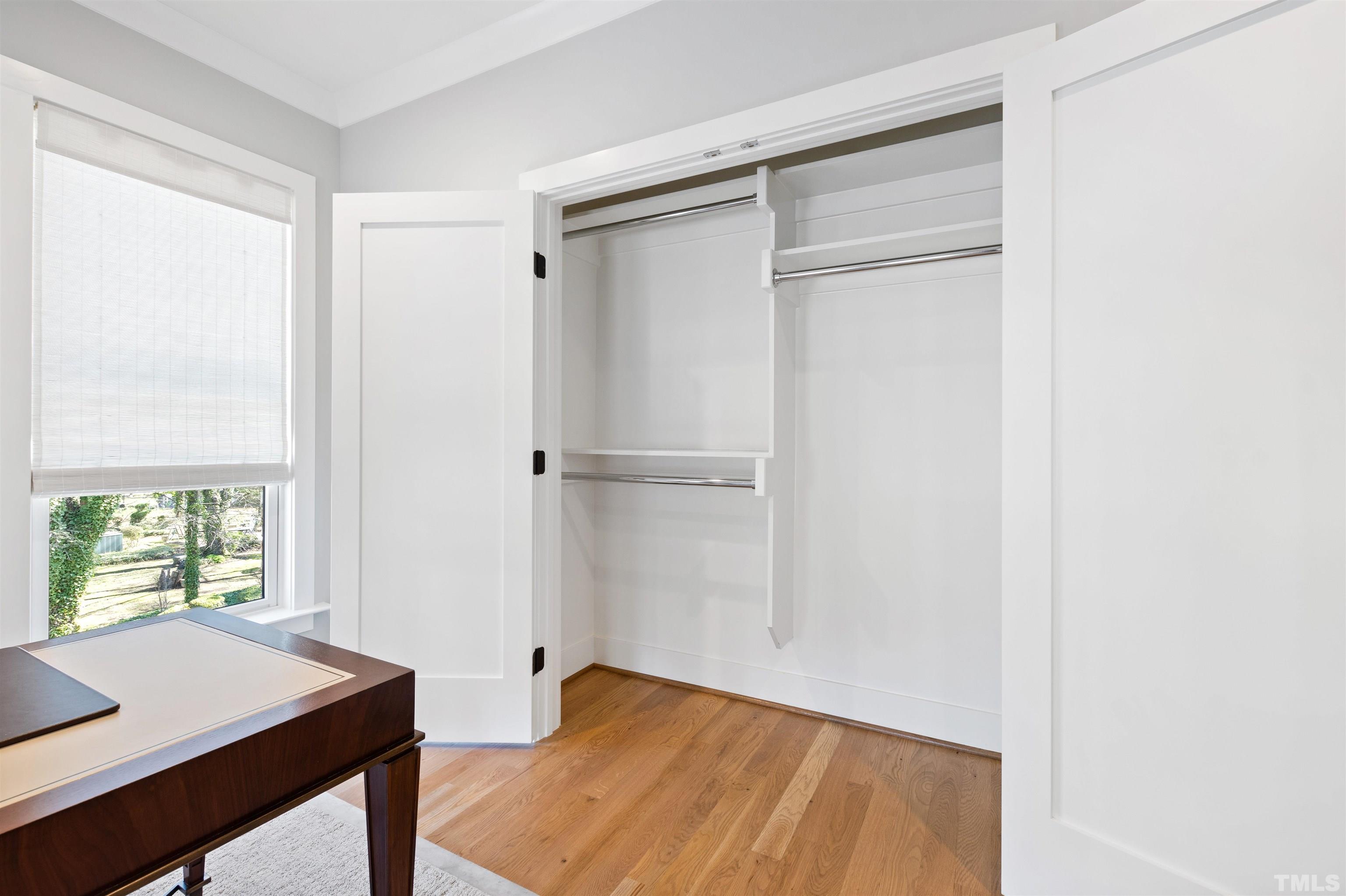 910 Oberlin Road, Unit 103 Raleigh, NC 27605 - Photo 26 of 47 a view of room with window and wooden floor