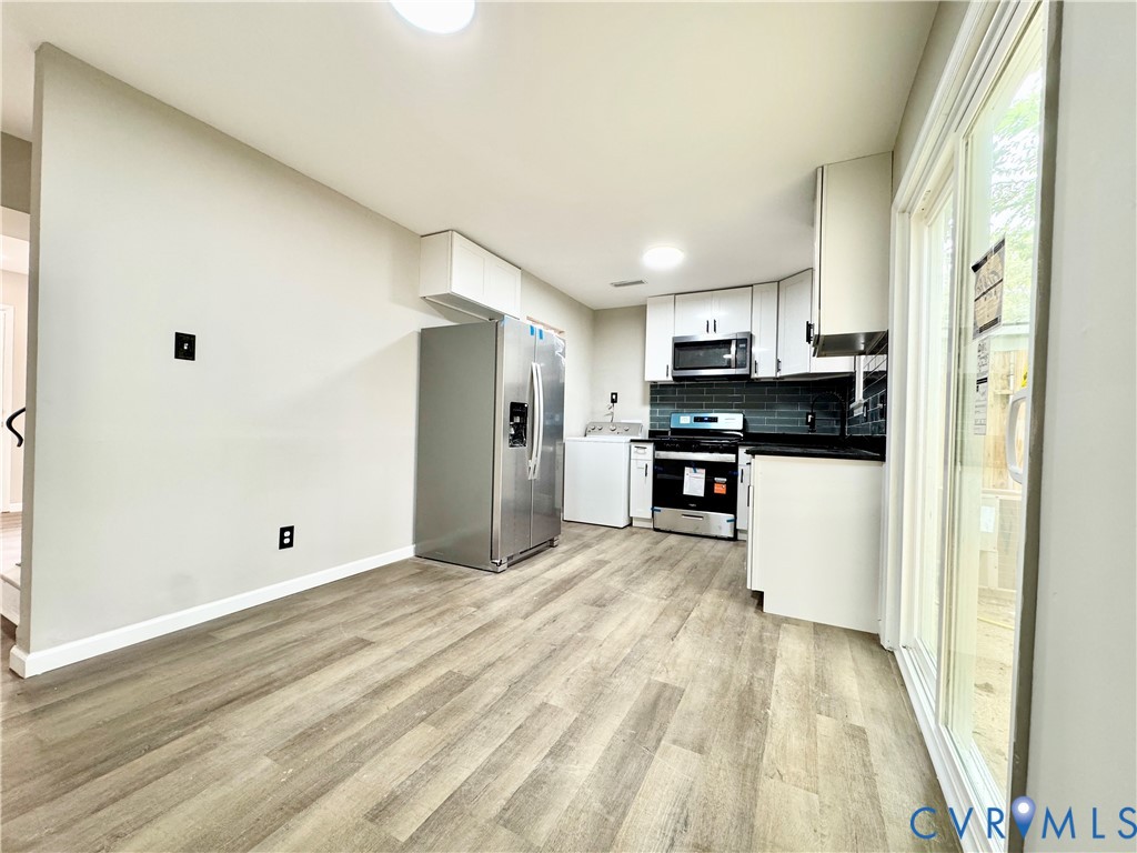 403 Roxana Road Henrico, VA 23075 - Photo 9 of 42 Kitchen with light wood-finish flooring, white cab