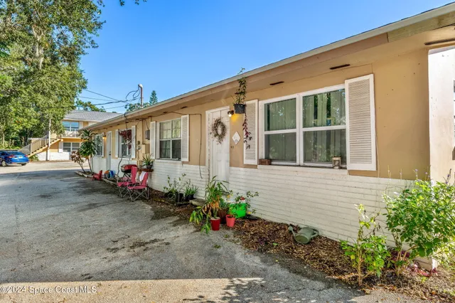 a view of a house with a street