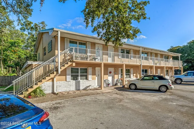 a view of a house with a small yard