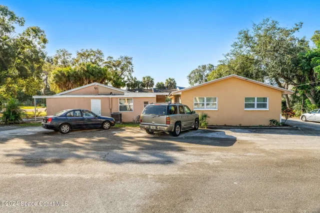 a car parked in front of a house