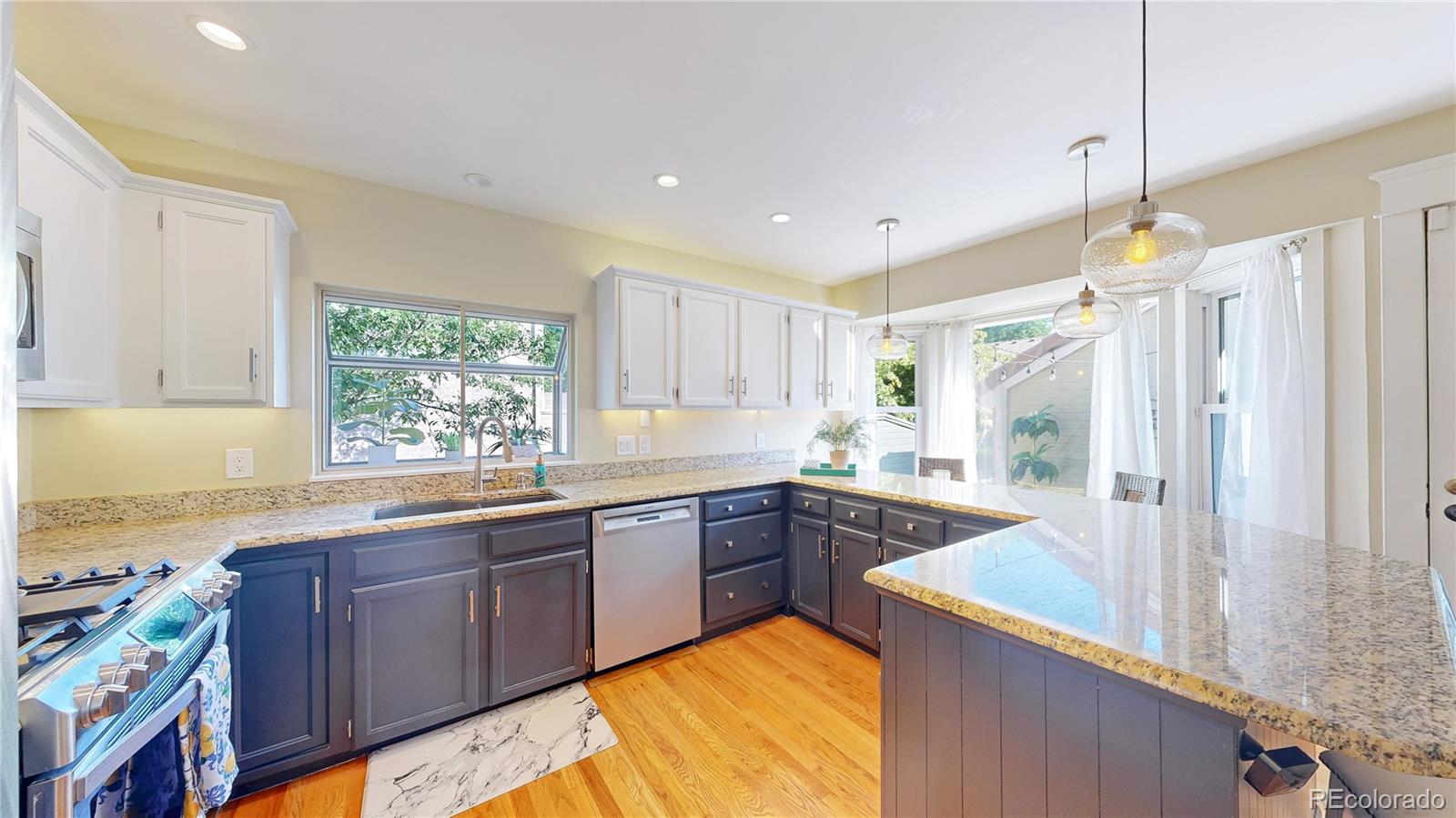 2335 Ranch Drive Westminster, CO 80234 - Photo 11 of 47 a kitchen with a sink stove and refrigerator