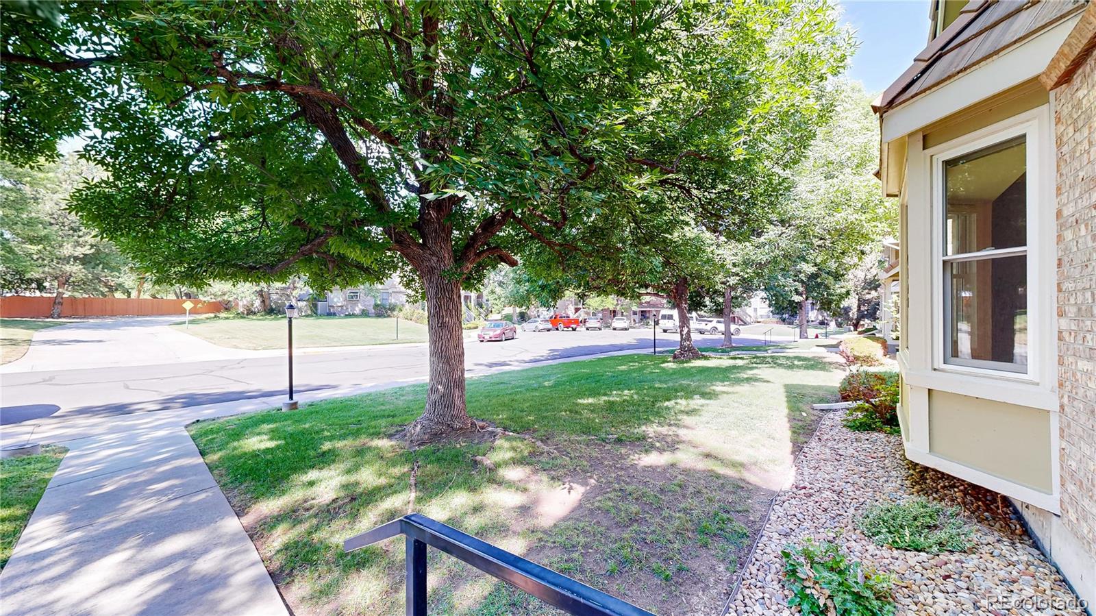 2335 Ranch Drive Westminster, CO 80234 - Photo 3 of 47 a view of a house with backyard and a tree