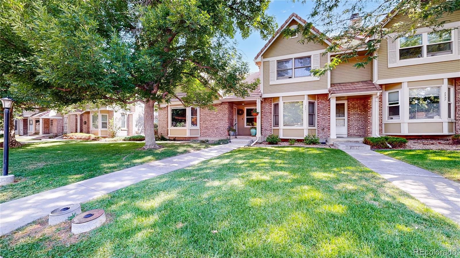 2335 Ranch Drive Westminster, CO 80234 - Photo 34 of 47 front view of a house with a yard