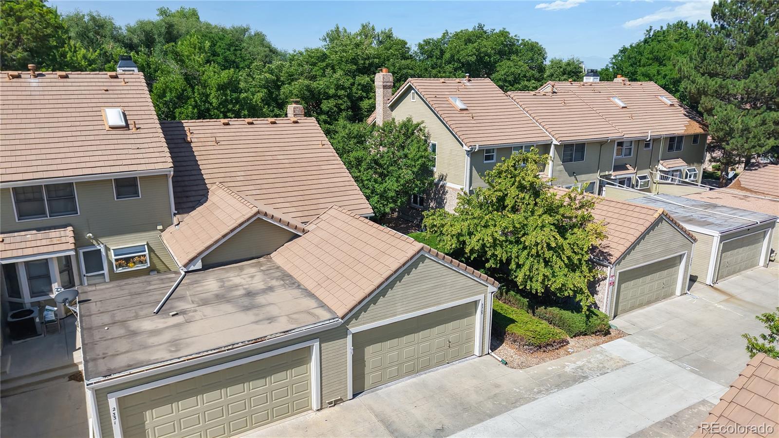 2335 Ranch Drive Westminster, CO 80234 - Photo 37 of 47 aerial view of a house with yard and trees in the background