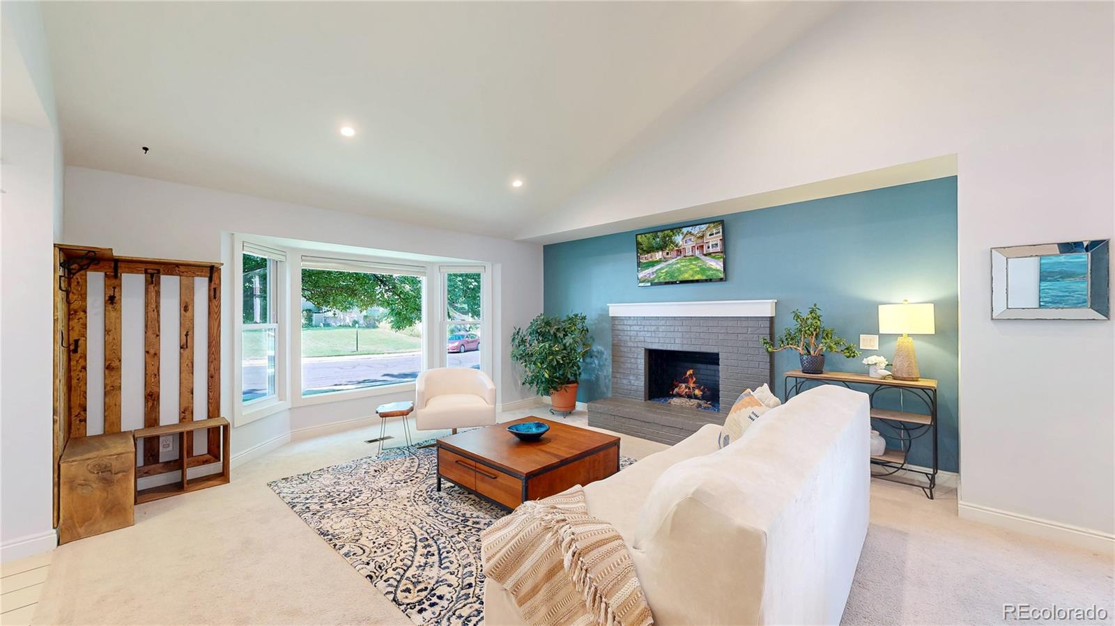 2335 Ranch Drive Westminster, CO 80234 - Photo 7 of 47 a bedroom with a bed and a fireplace