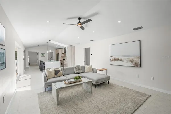 a living room with furniture and a rug