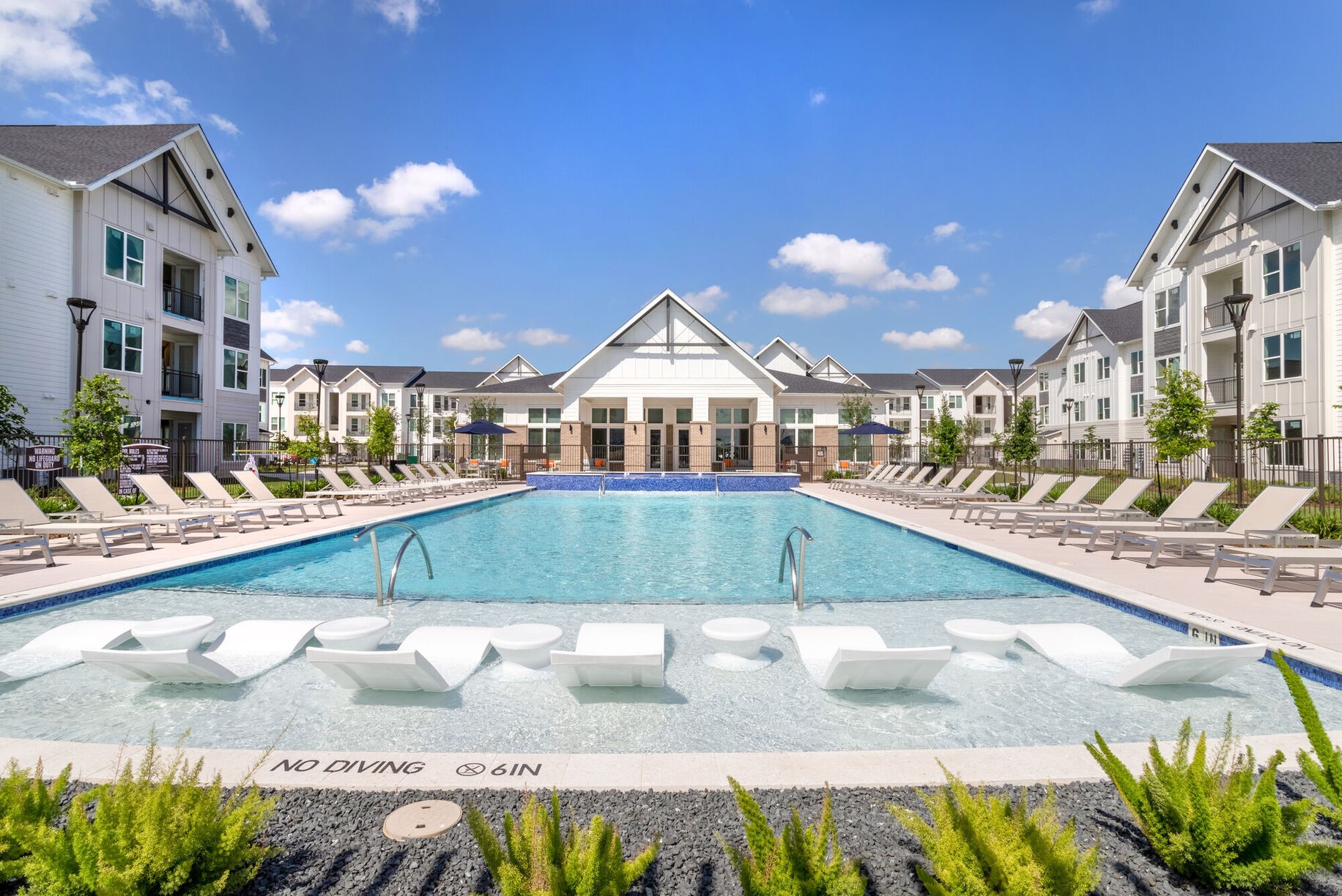 13939 Hillcroft Avenue, Unit 3303 Houston, TX 77085 - Photo 19 of 23 a view of a swimming pool with a lounge chairs