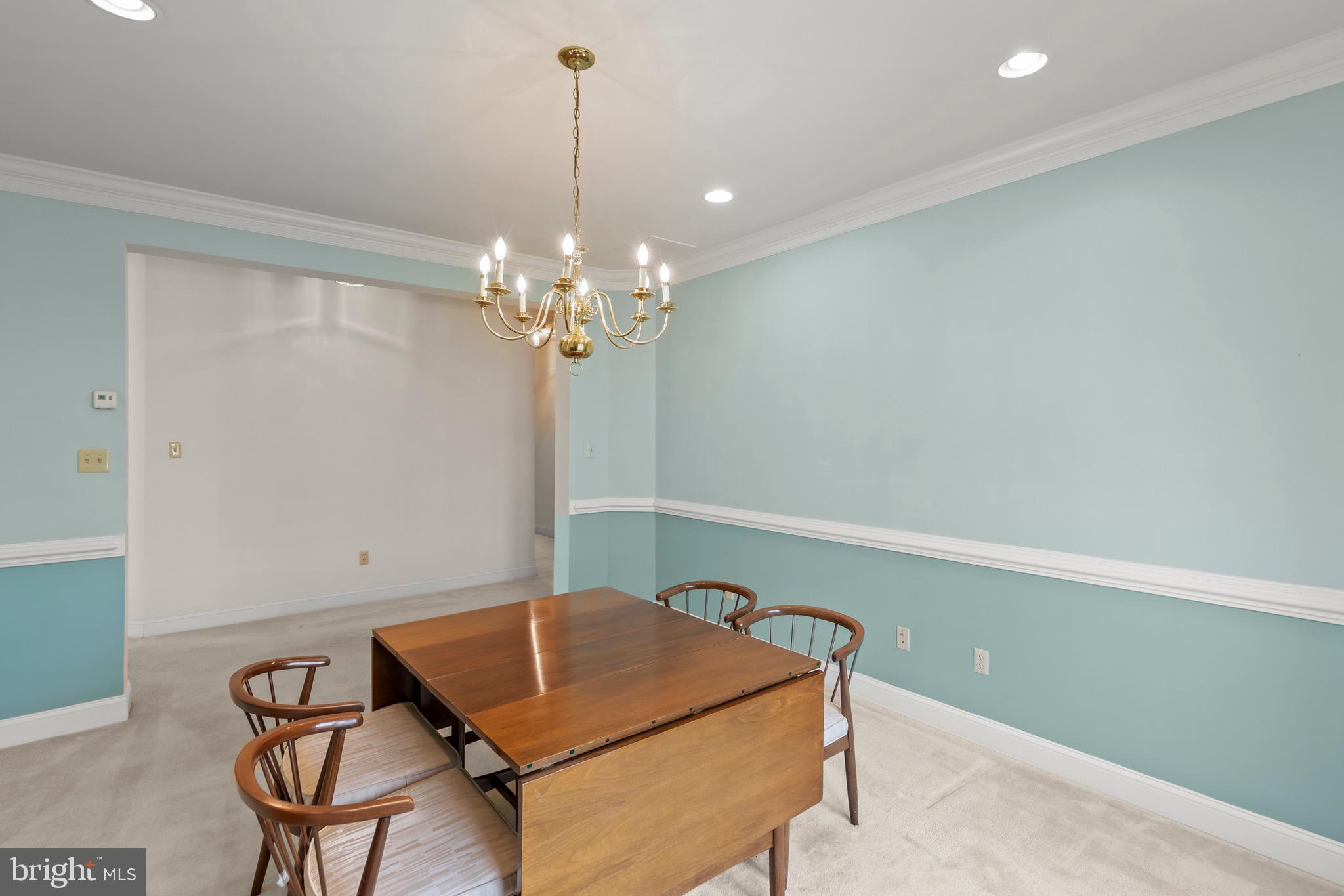 152 Harvest Ridge Drive Winchester, VA 22601 - Photo 16 of 43 a room with table chairs and wooden floor
