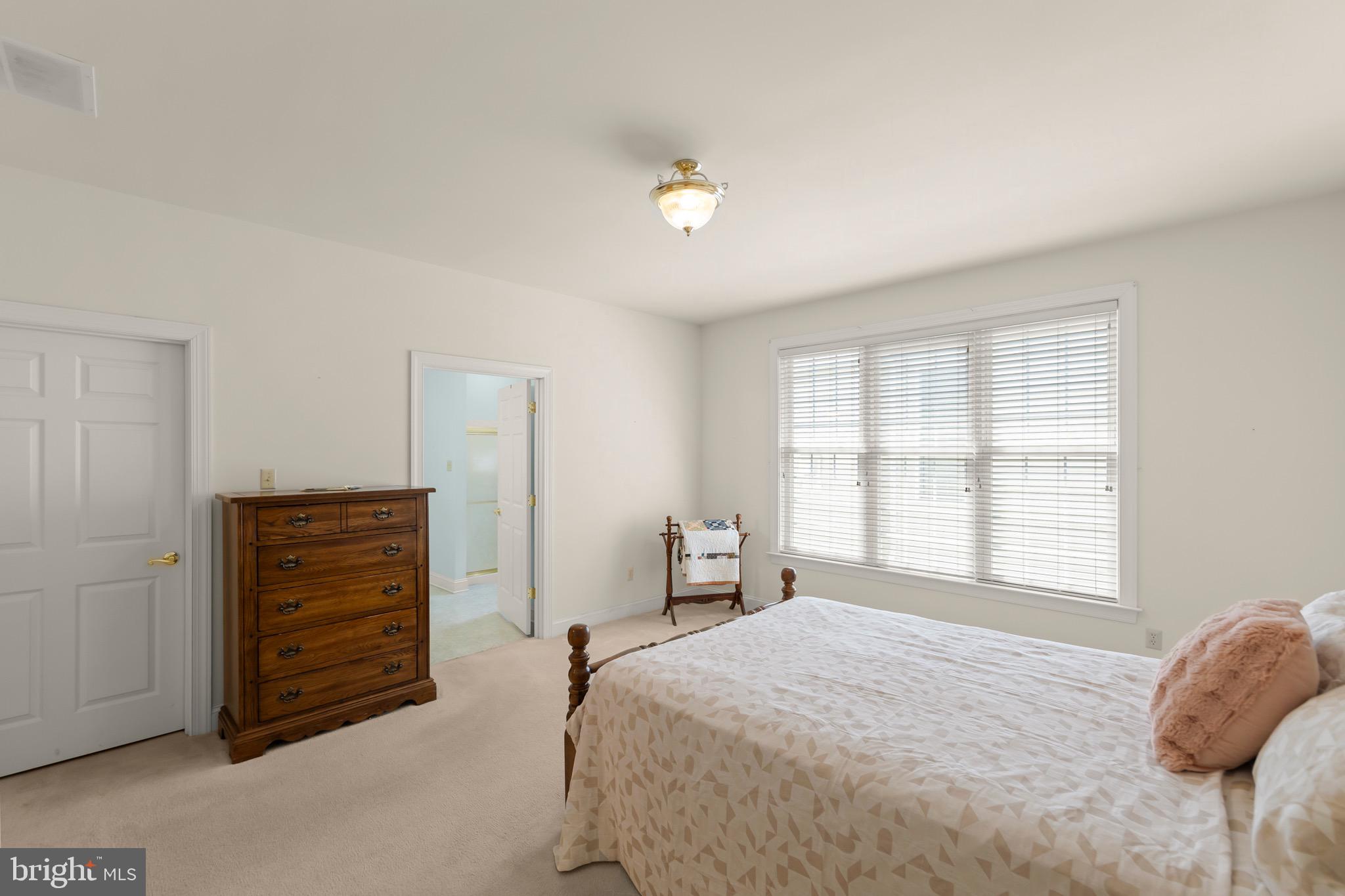 152 Harvest Ridge Drive Winchester, VA 22601 - Photo 18 of 43 a bedroom with a bed and a window