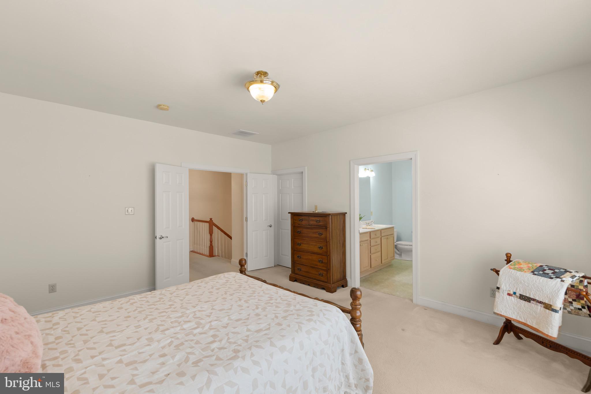 152 Harvest Ridge Drive Winchester, VA 22601 - Photo 19 of 43 a bedroom with a bed and furniture