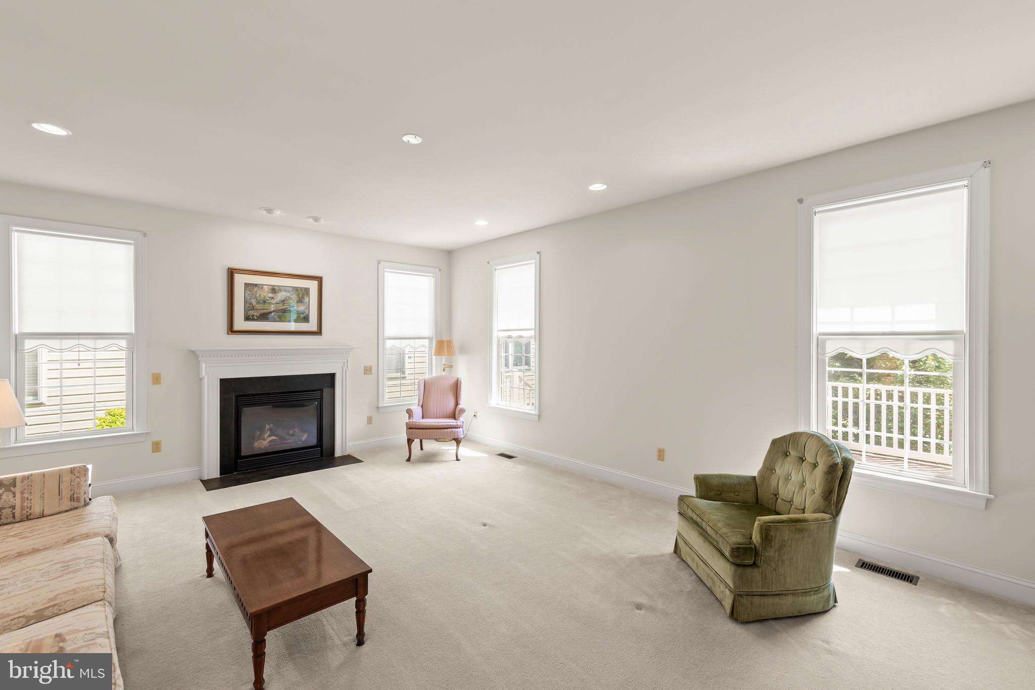 152 Harvest Ridge Drive Winchester, VA 22601 - Photo 2 of 43 a living room with furniture and a fireplace
