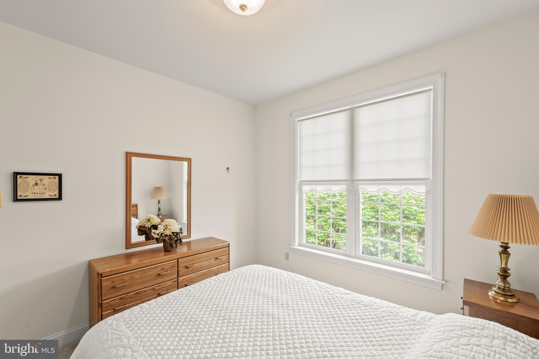 152 Harvest Ridge Drive Winchester, VA 22601 - Photo 27 of 43 a bedroom with a bed and large windows