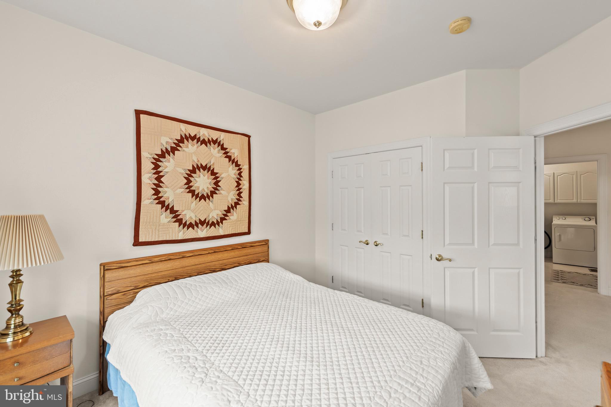 152 Harvest Ridge Drive Winchester, VA 22601 - Photo 28 of 43 a bedroom with a bed and a refrigerator