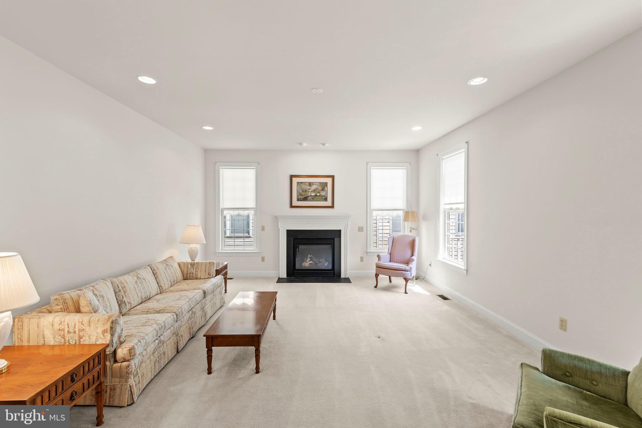 152 Harvest Ridge Drive Winchester, VA 22601 - Photo 3 of 43 a living room with furniture and a fireplace