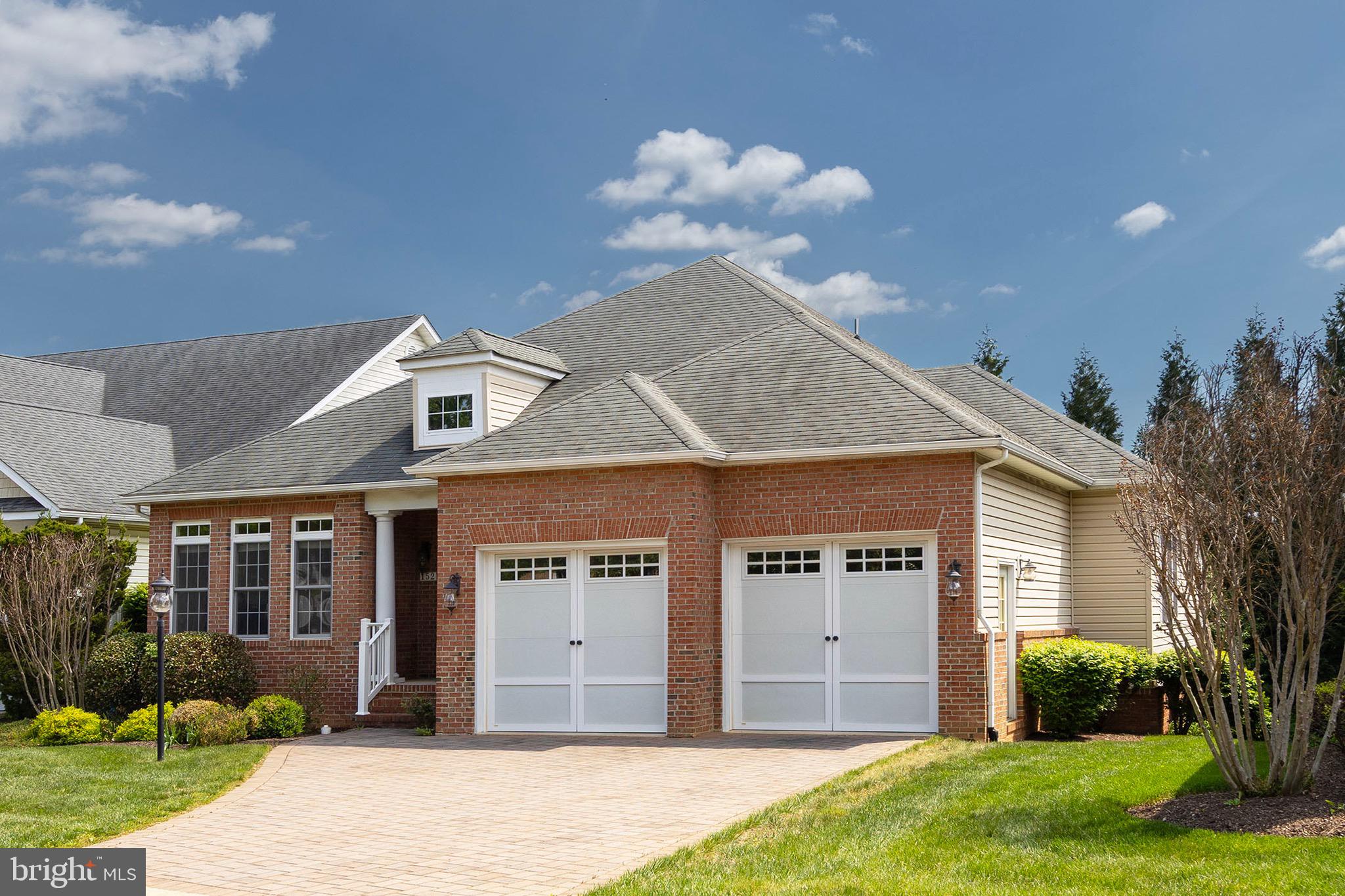 152 Harvest Ridge Drive Winchester, VA 22601 - Photo 43 of 43 a front view of a house with a garden and plants