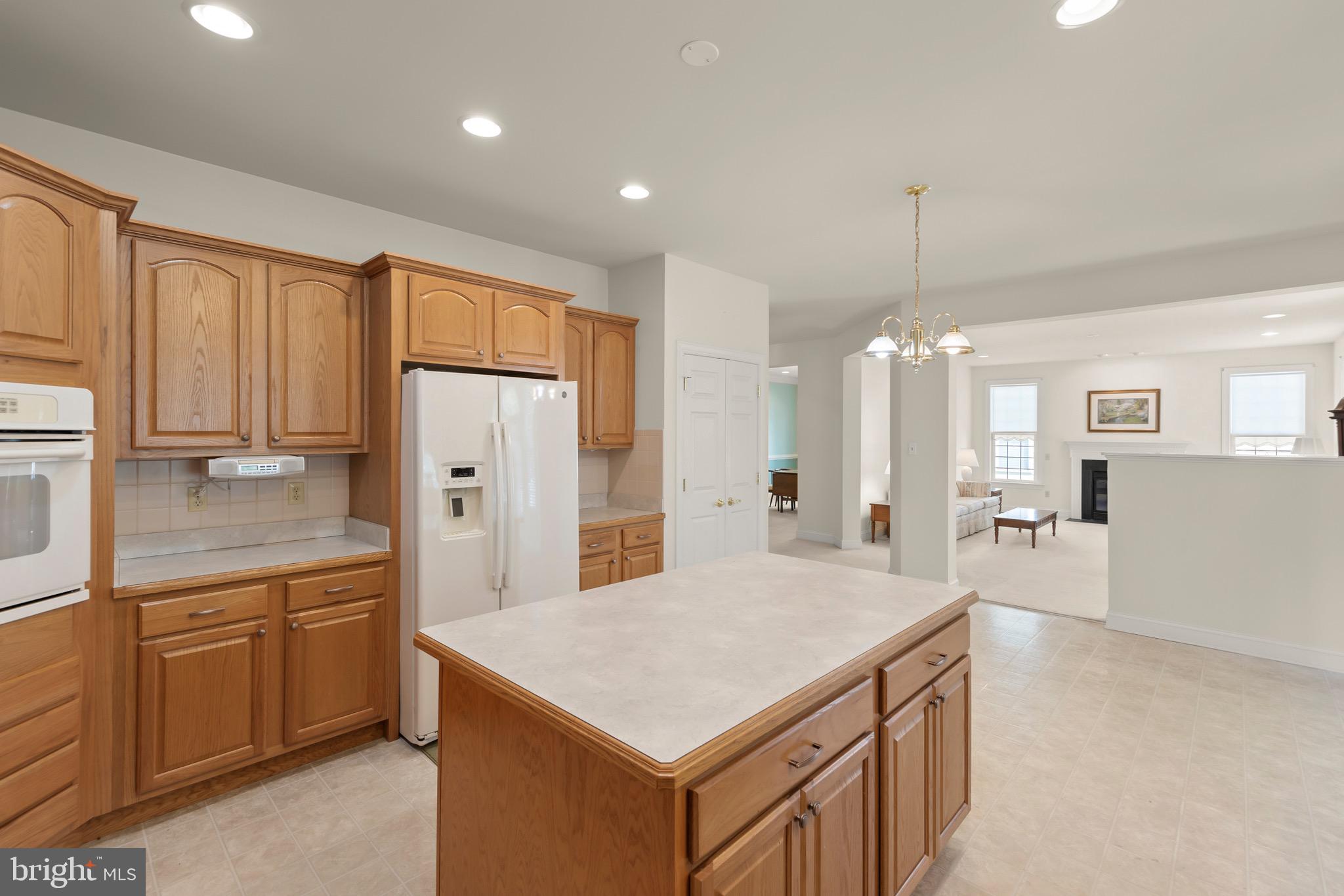 152 Harvest Ridge Drive Winchester, VA 22601 - Photo 9 of 43 a kitchen that has a lot of cabinets in it and wooden floors